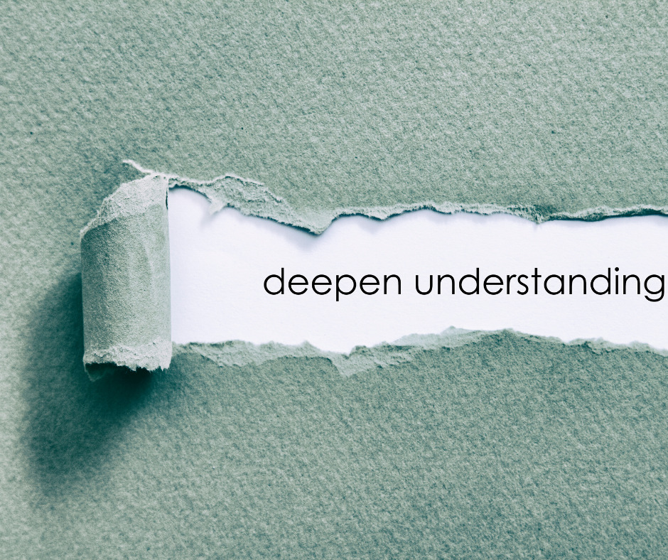 paper with a torn strip revealing the words 'deeper understanding'